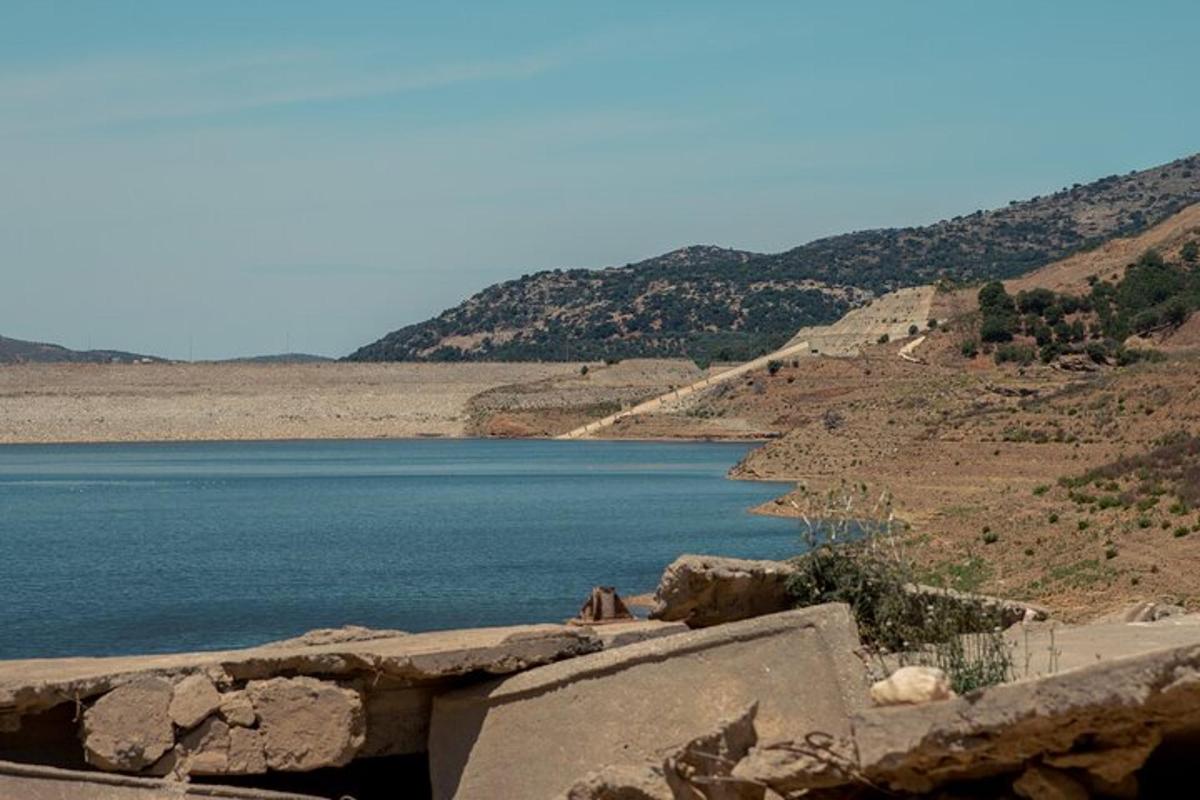 a view of a body of water with mountains in the background