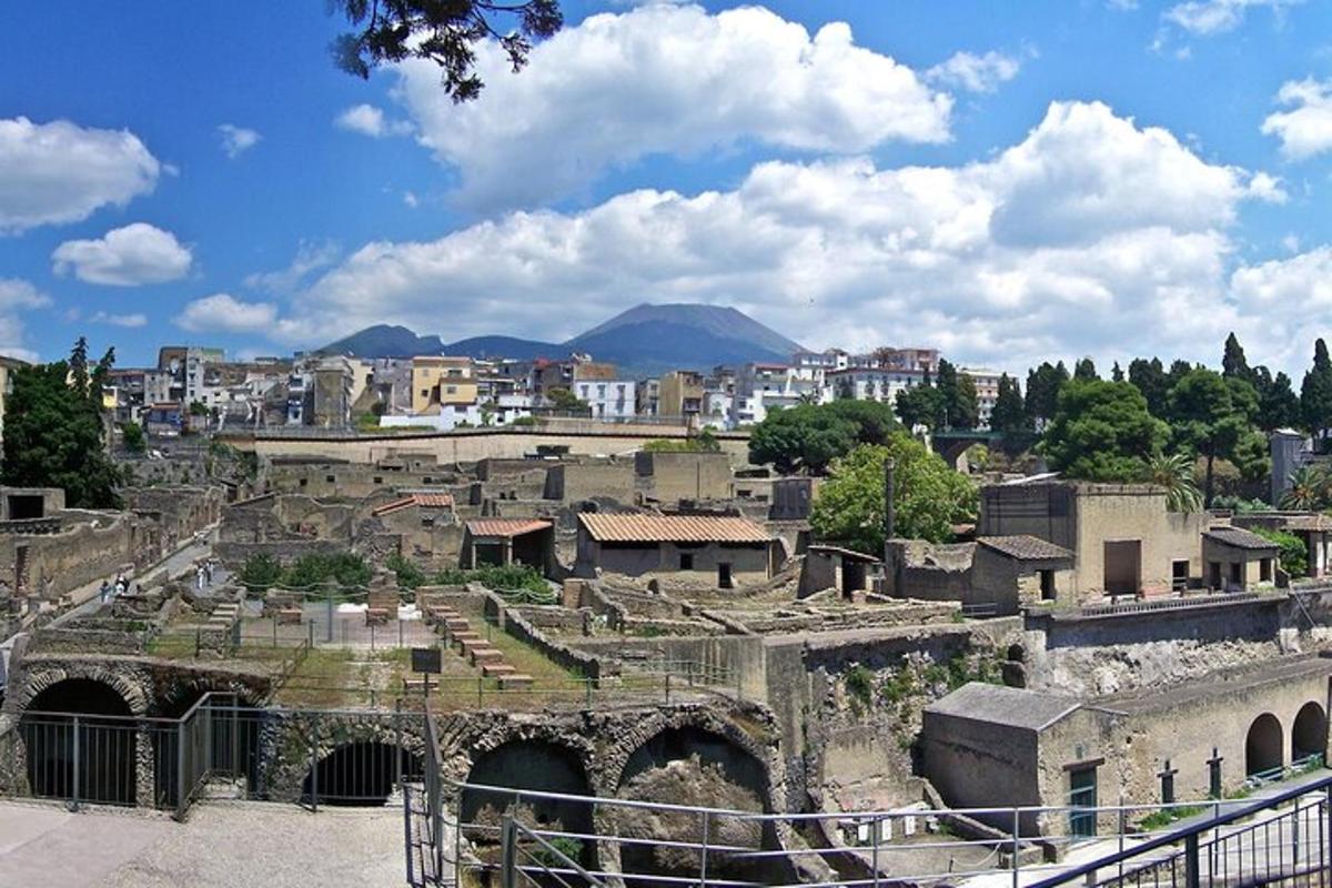 an old city with buildings and a city with mountains