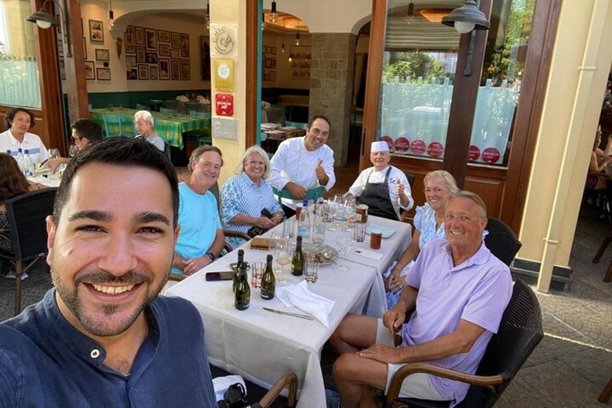 a group of people sitting at a table in a restaurant
