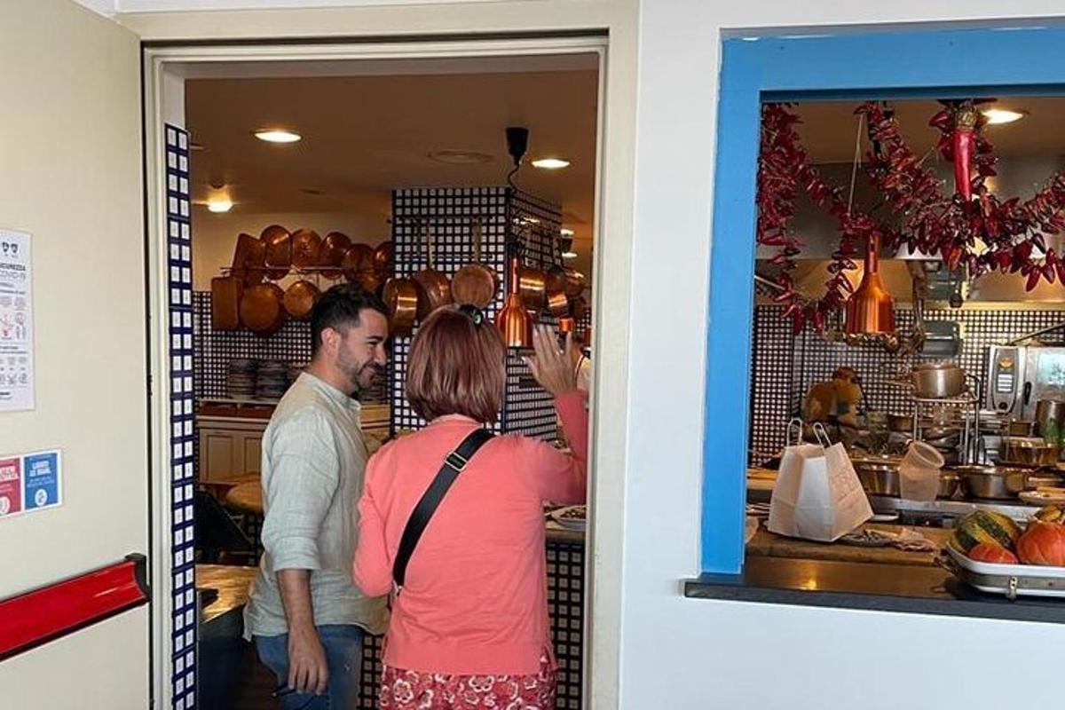 a man and a woman standing in front of a store
