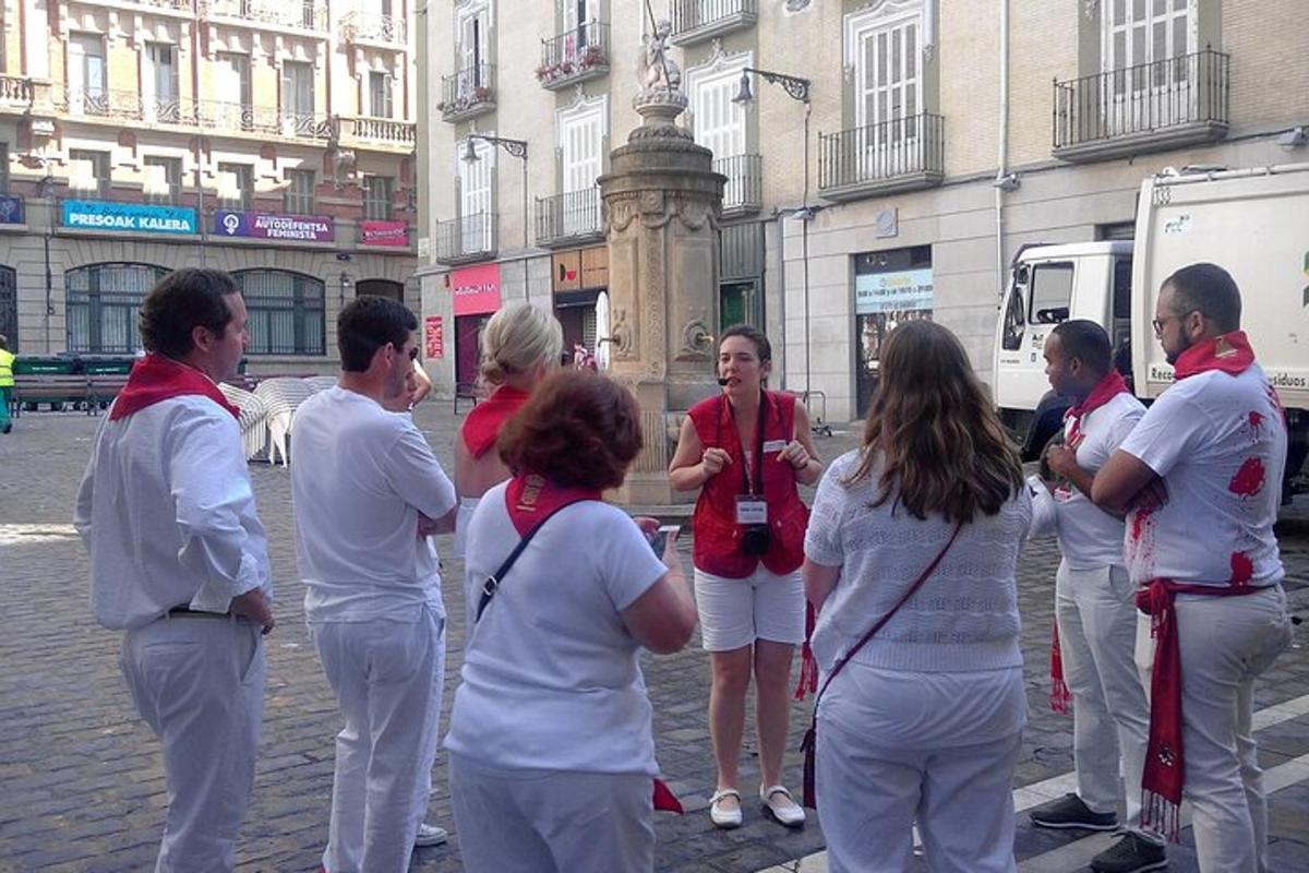 a group of people standing on a city street