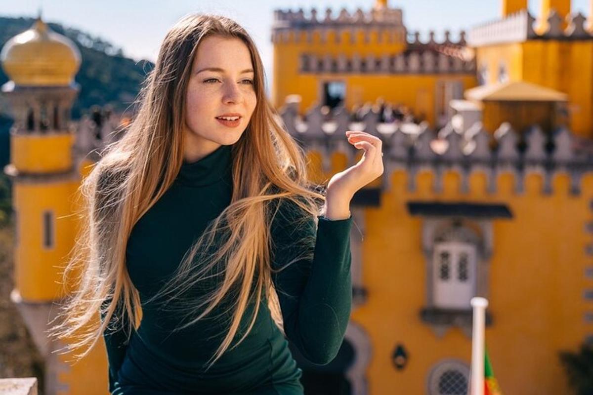 a young woman standing in front of a castle