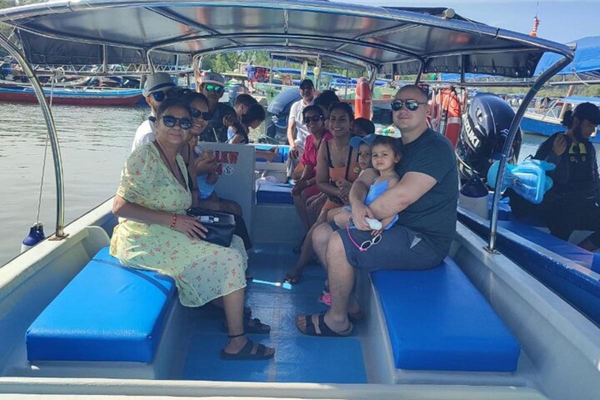 a group of people sitting on a boat