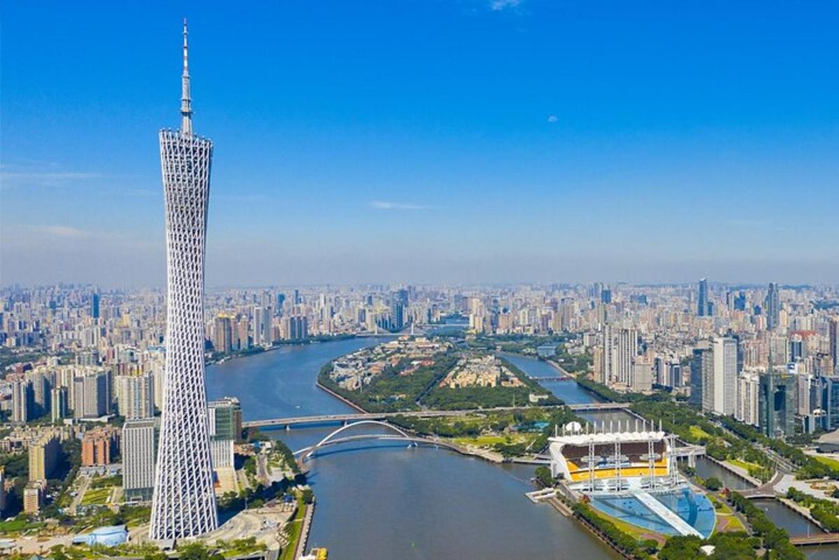 an aerial view of a city with a tall building