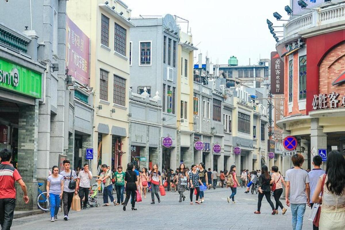 a crowd of people walking down a city street