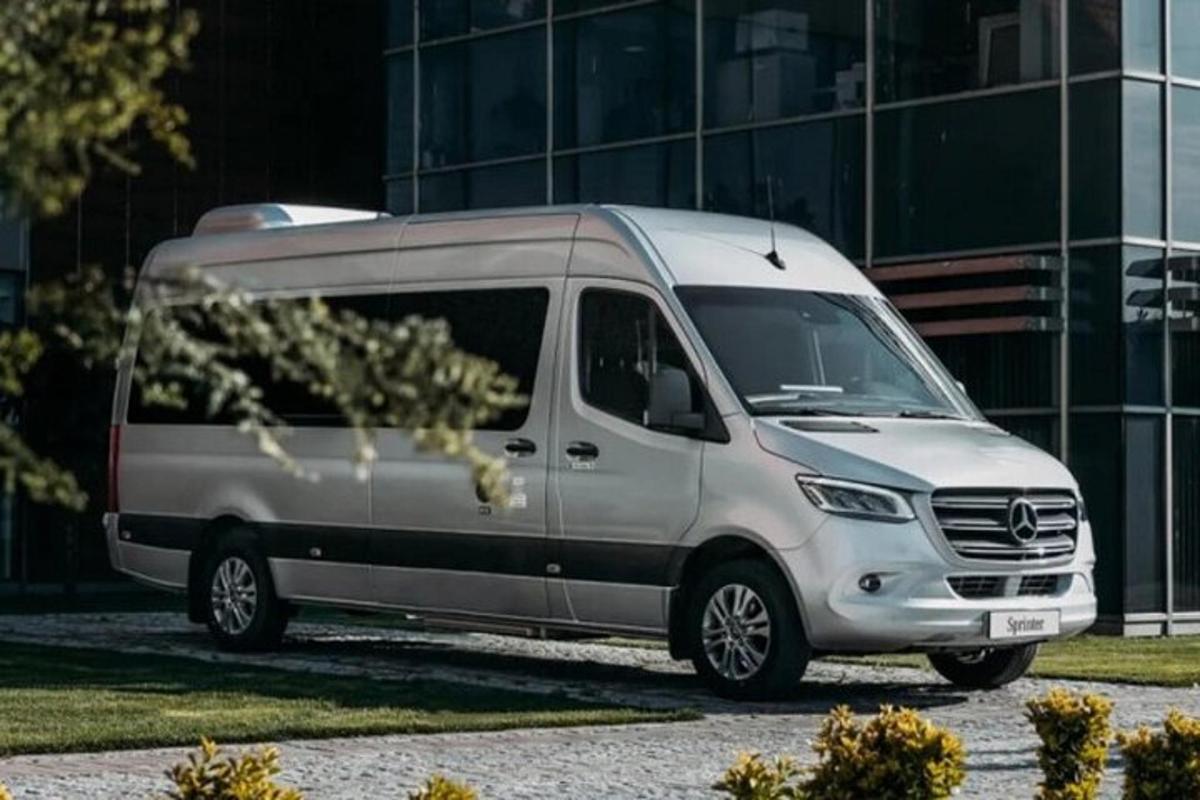 a white van parked in front of a building
