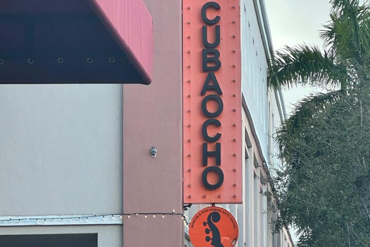 a sign for a hotel on the side of a building
