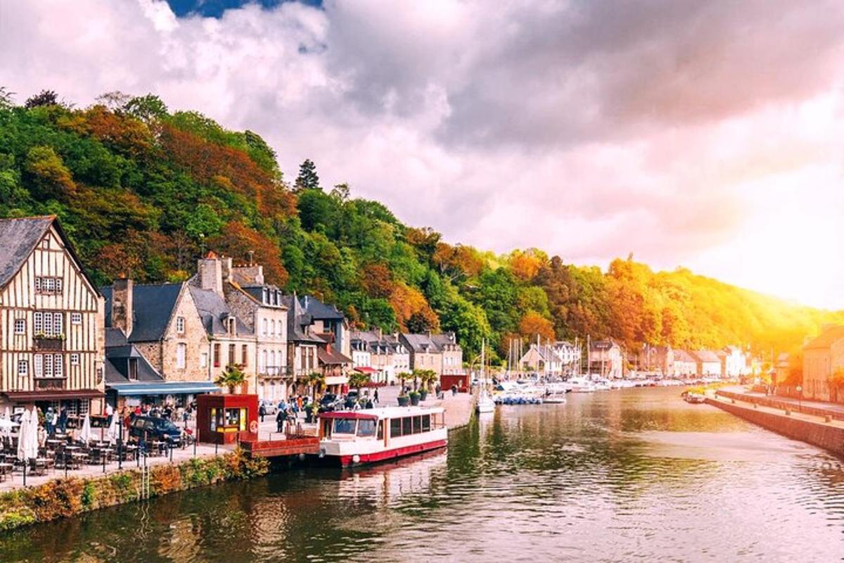 a river with houses and boats in a town