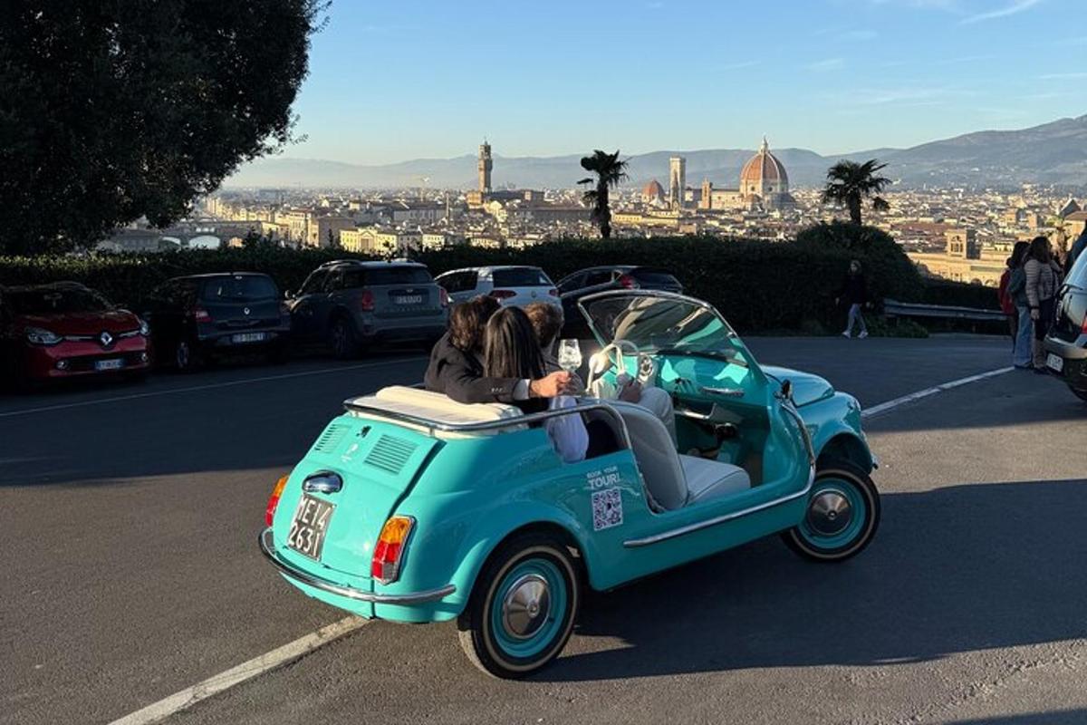 a couple of people riding in a small car