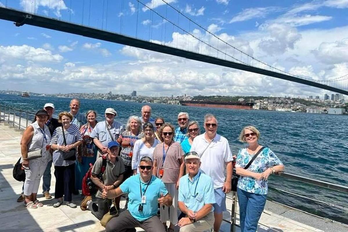 a group of people posing for a picture on a boat