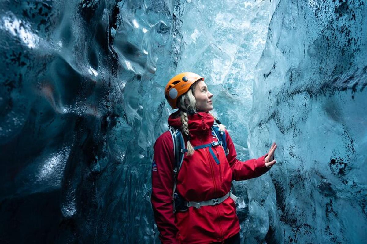 a woman is standing in an ice cave