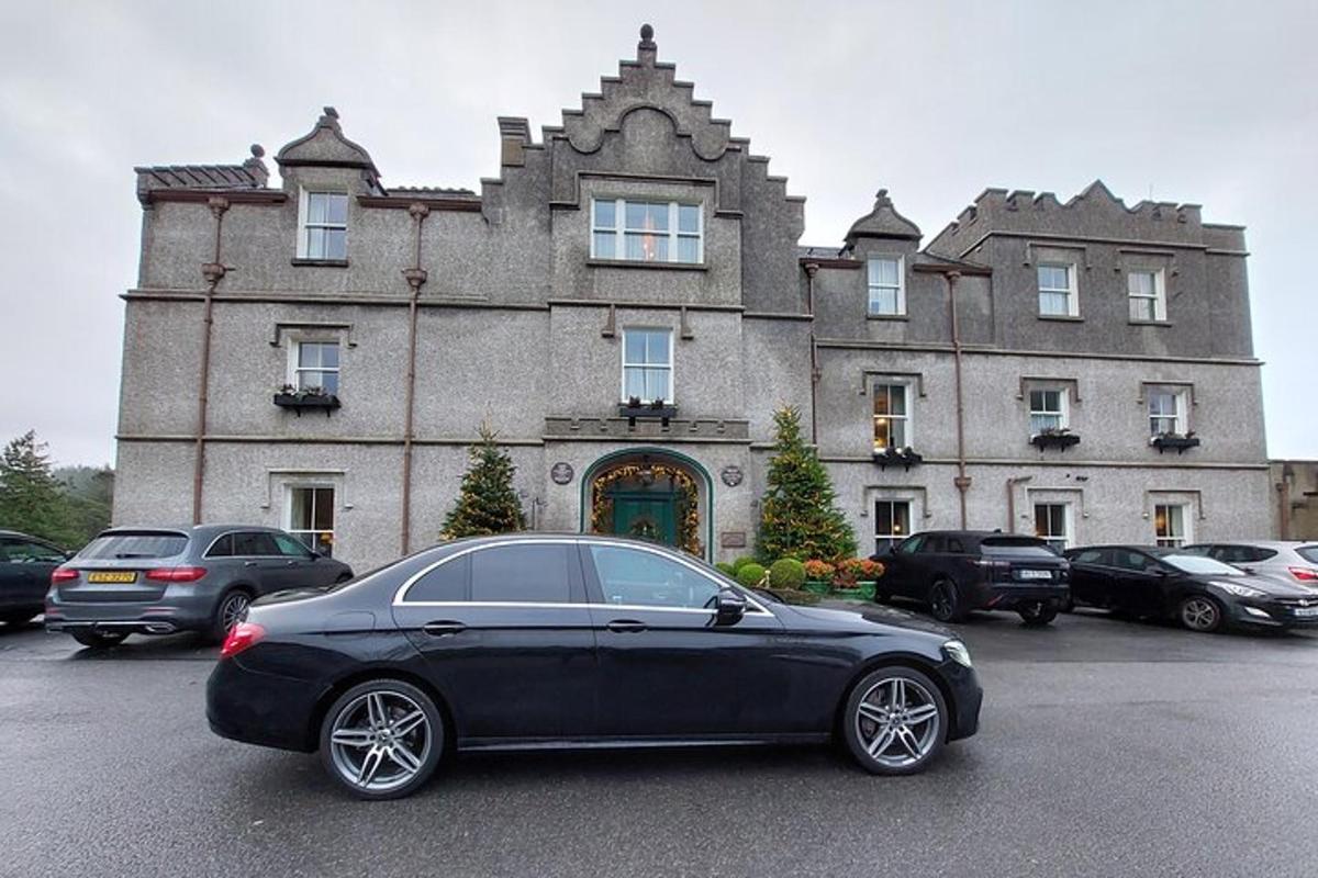 a black car parked in front of a building