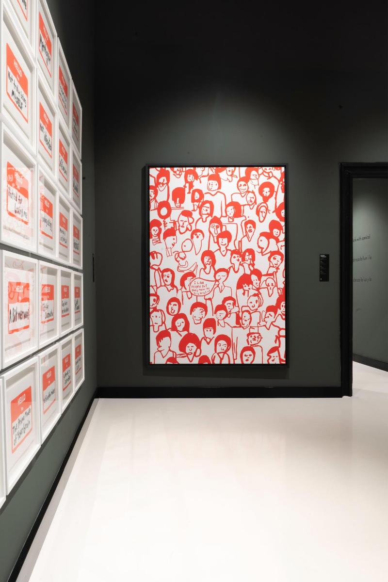 a large picture in a room with a red and white wall