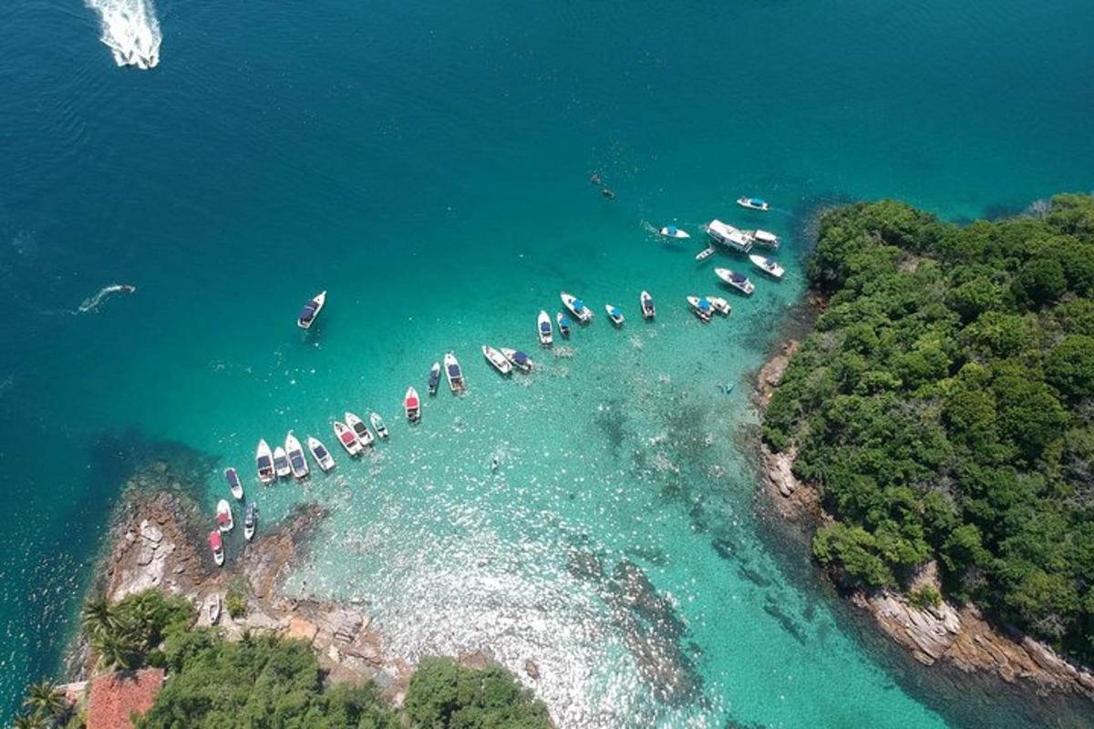 an aerial view of a group of boats in the water