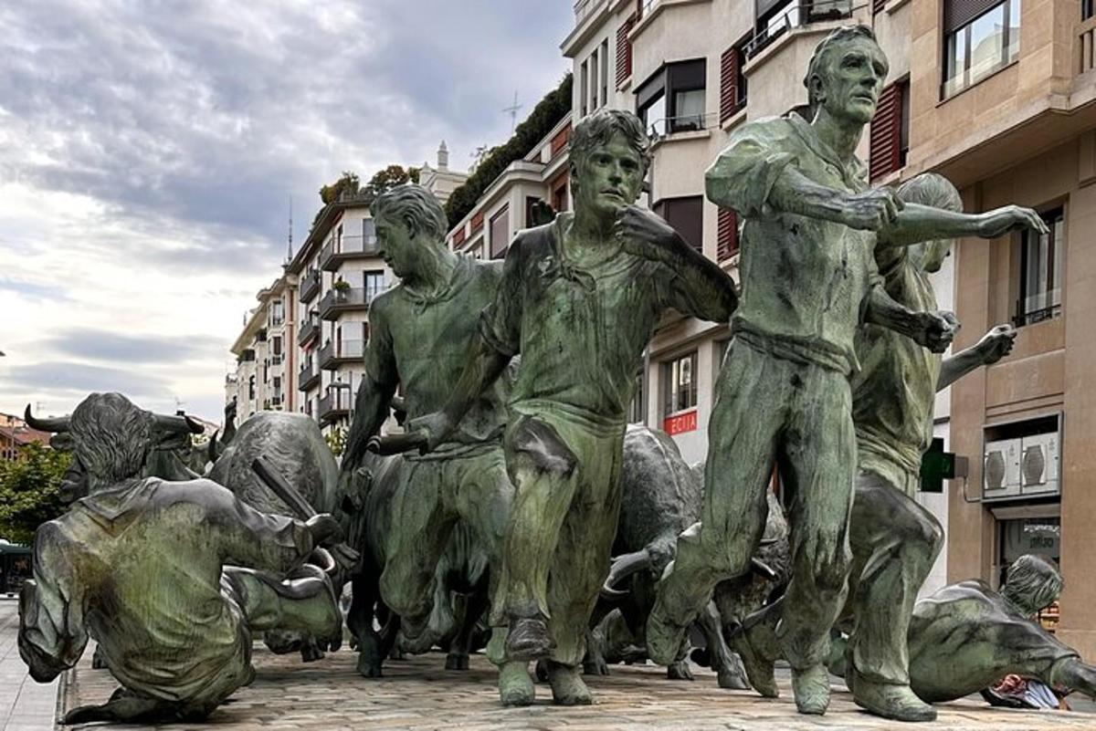 a statue of three men laying on the ground