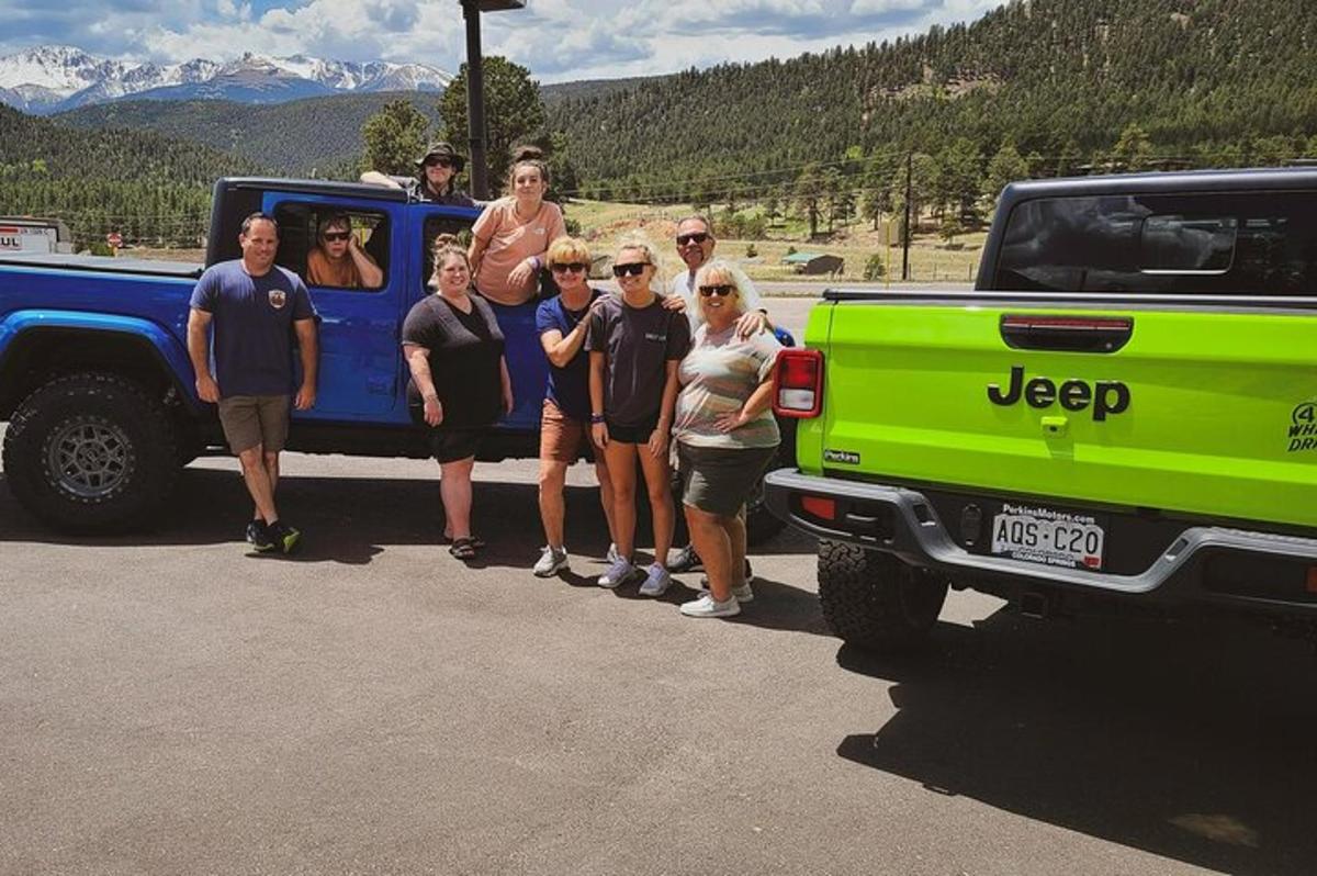 a group of people standing in the back of a truck