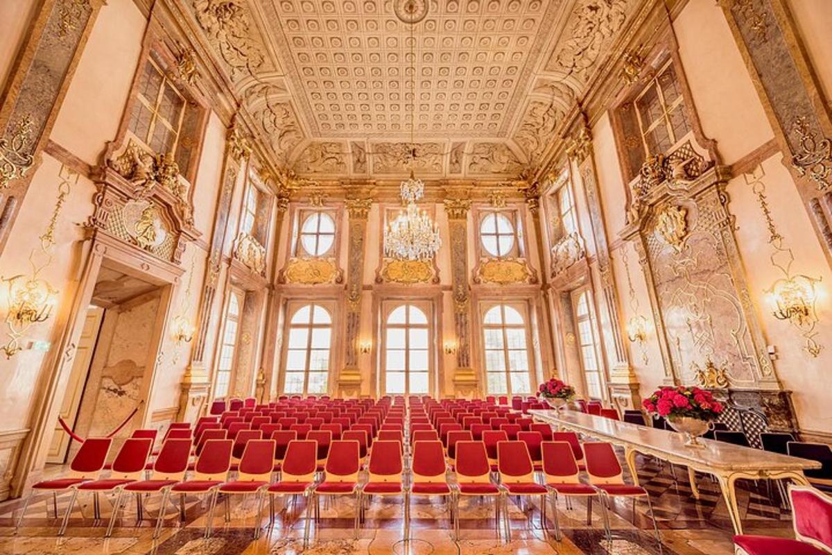 a large room with red chairs in a building