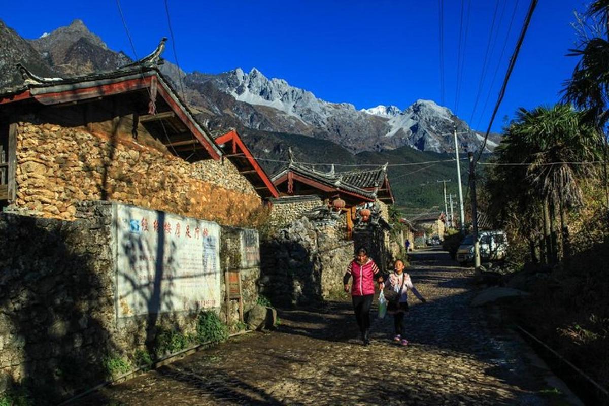 a woman and a child walking down a street