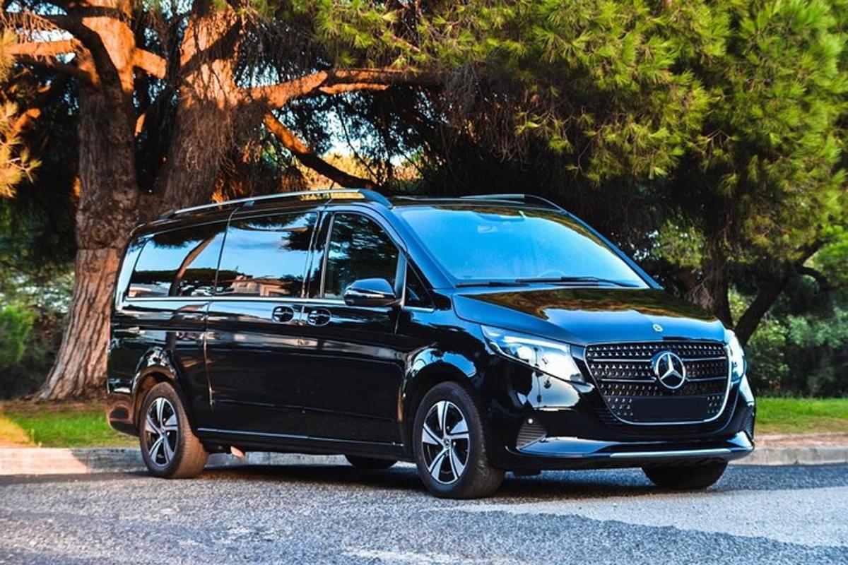 a black mercedes benz suv parked on a street