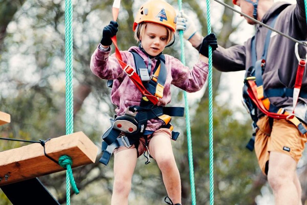 a young girl on a zip line