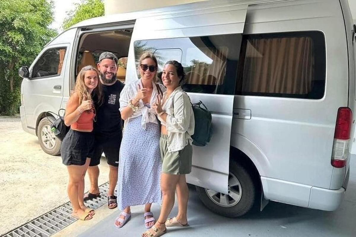 a group of people standing in front of a van