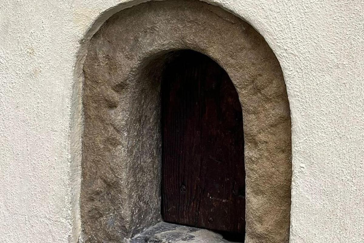 a wooden door in the side of a building