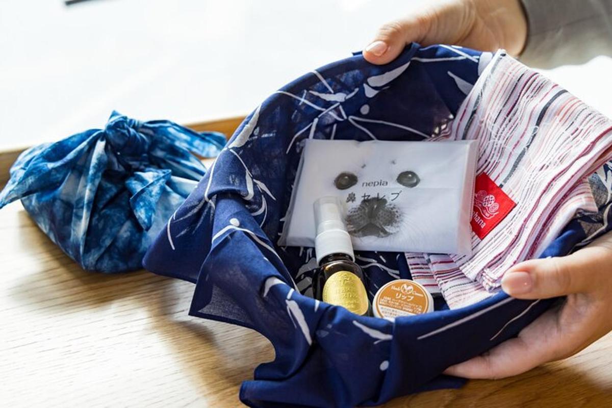 a person holding a bag filled with items on a table