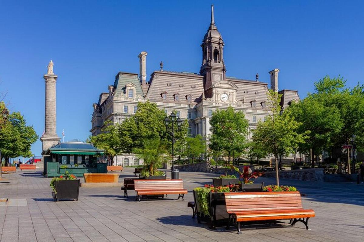 a large building with benches in front of it