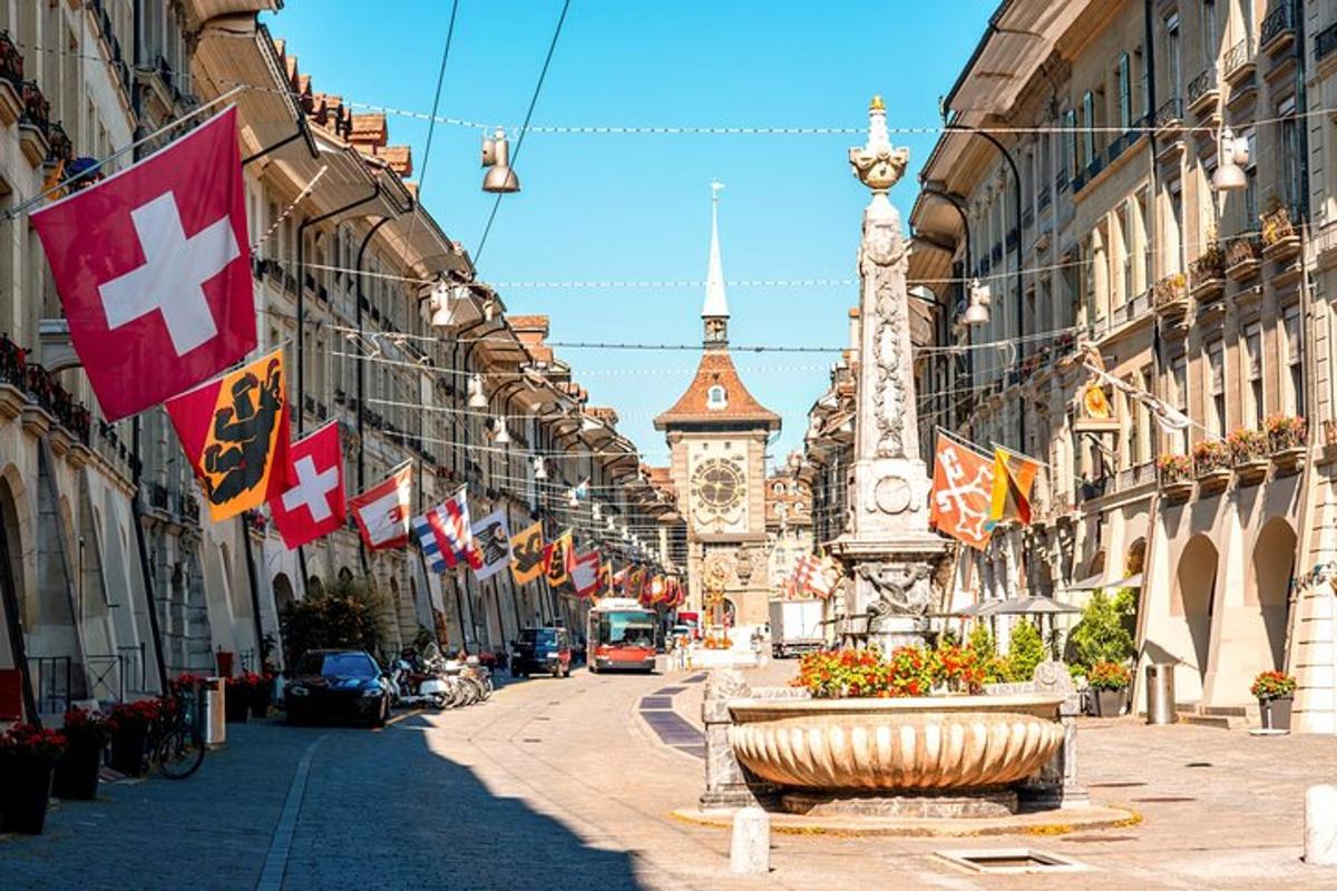 a city street with flags and a building with a clock tower