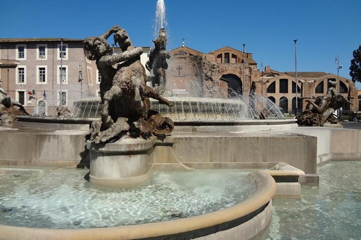 a fountain with two statues on top of it