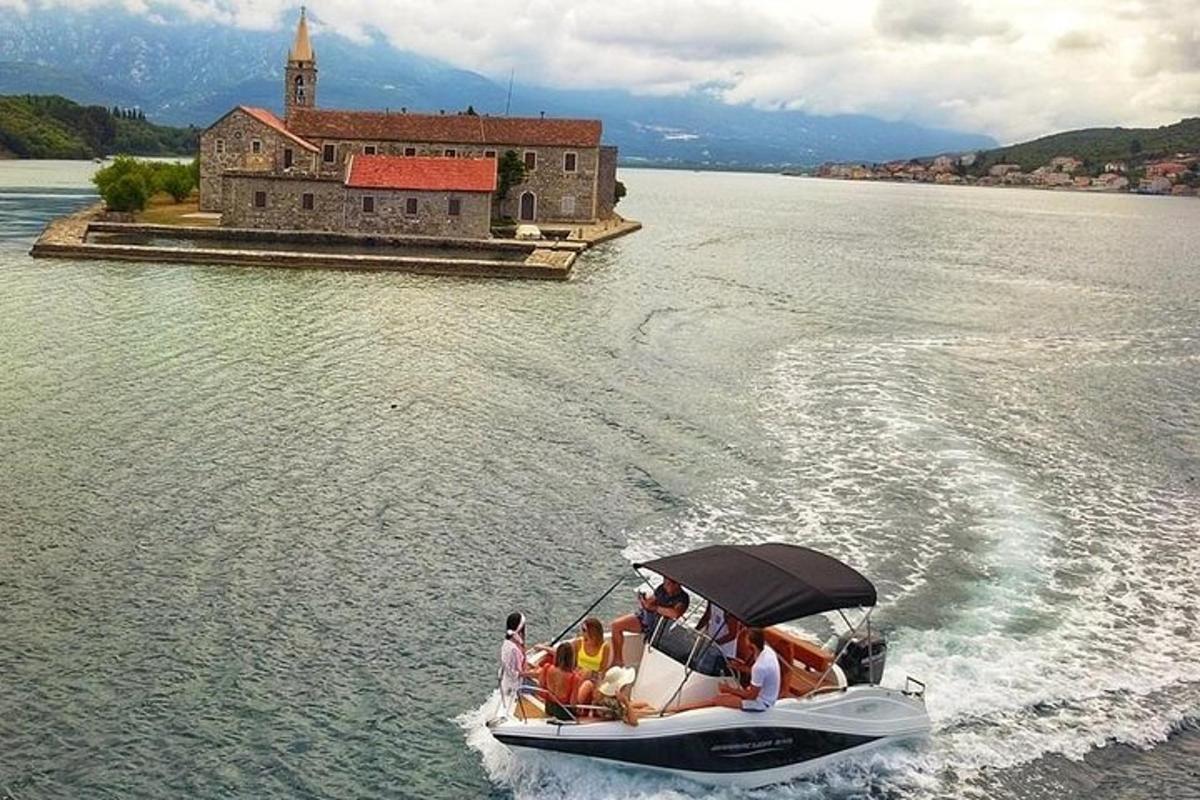 a group of people on a boat in the water