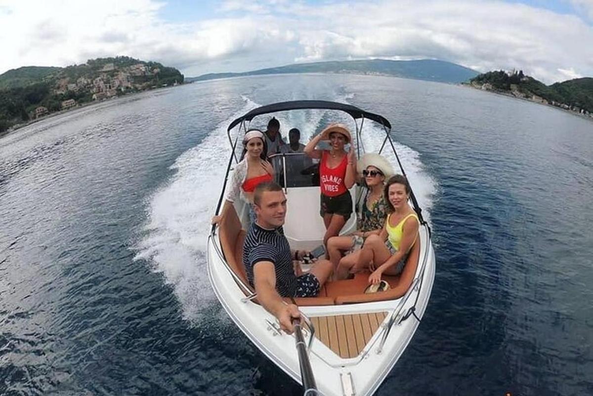 a group of people sitting in a boat on the water