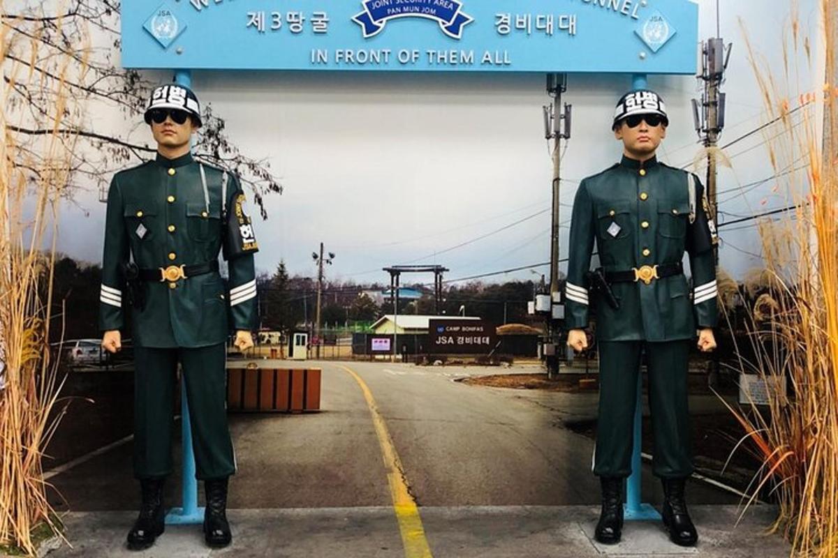 two men in uniform standing on a road