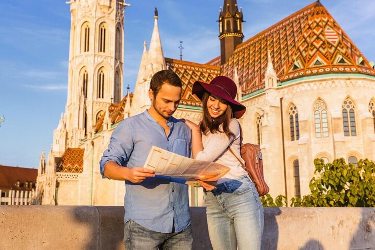 a man and a woman standing in front of a building