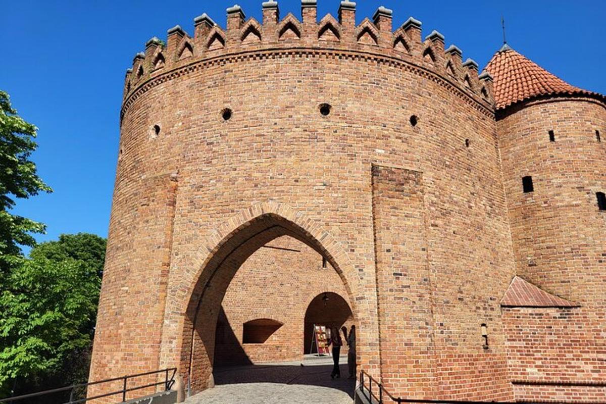 a large red brick building with an archway