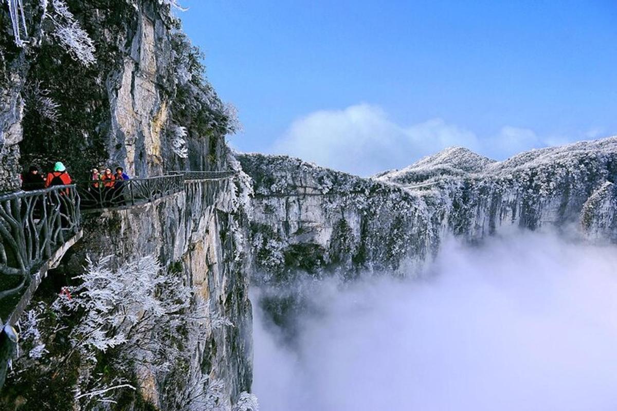 a group of people standing on top of a mountain