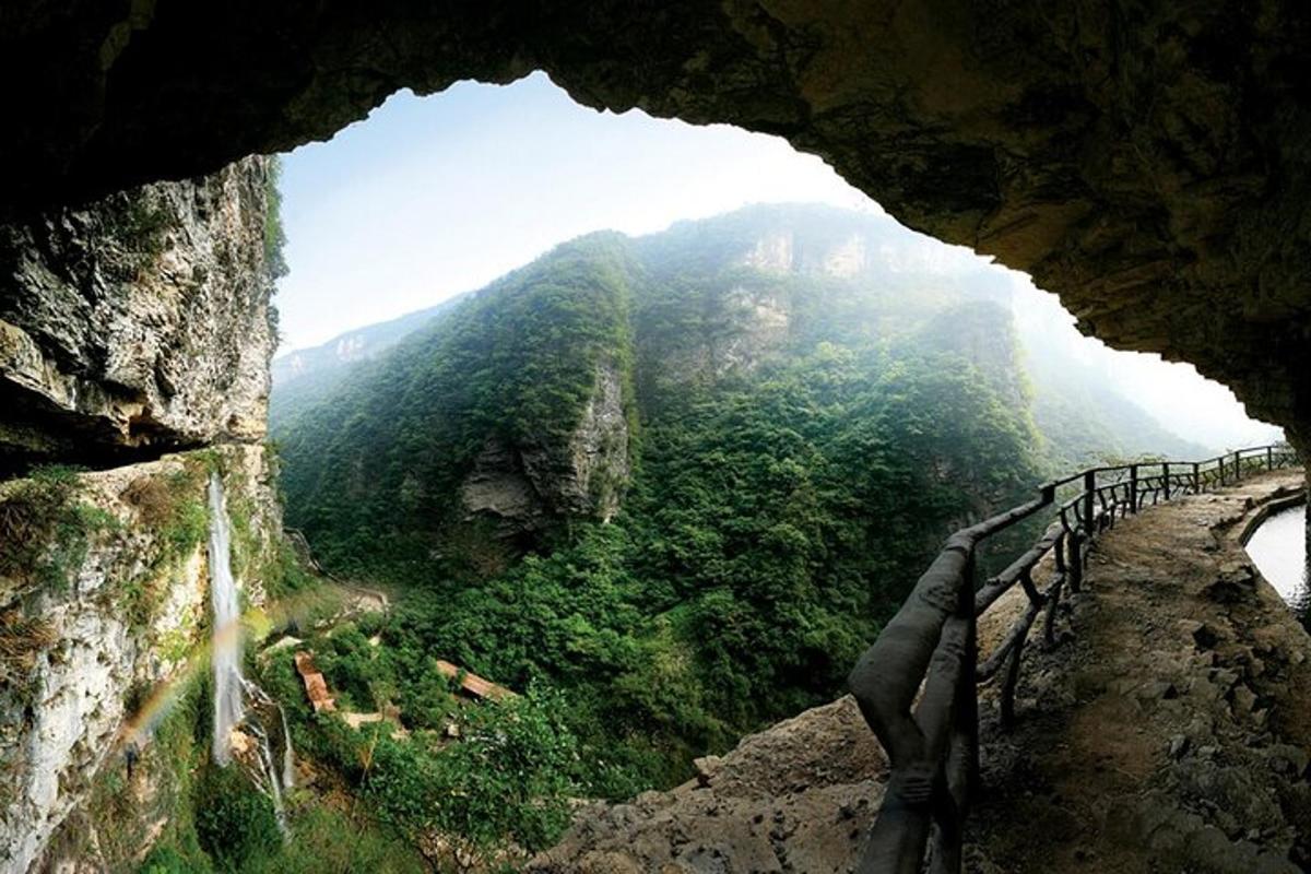 a view from inside a cave of a mountain