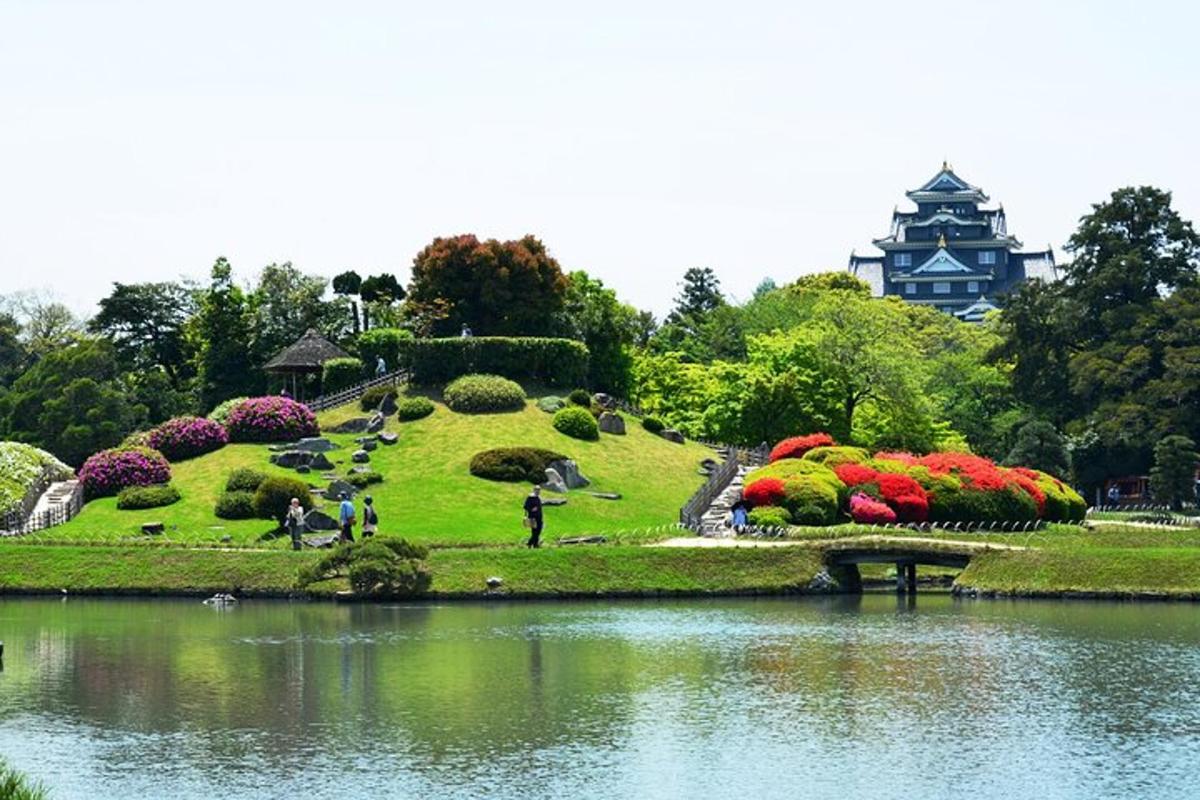 a park with a garden with flowers and a lake