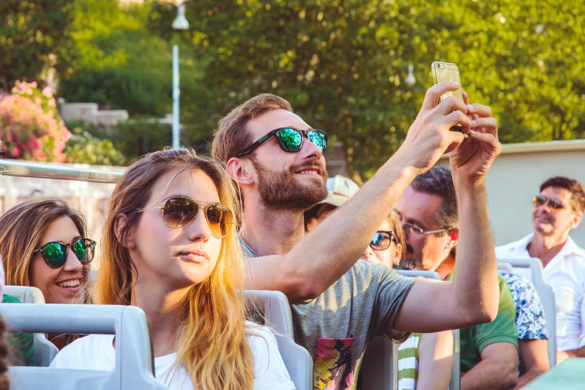 a man taking a picture of a crowd of people