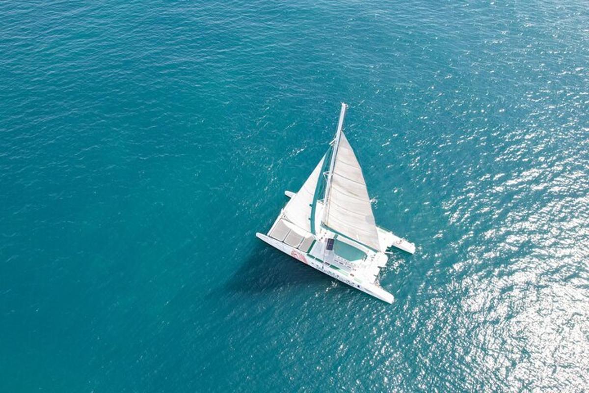 a white sailboat in the water in the ocean