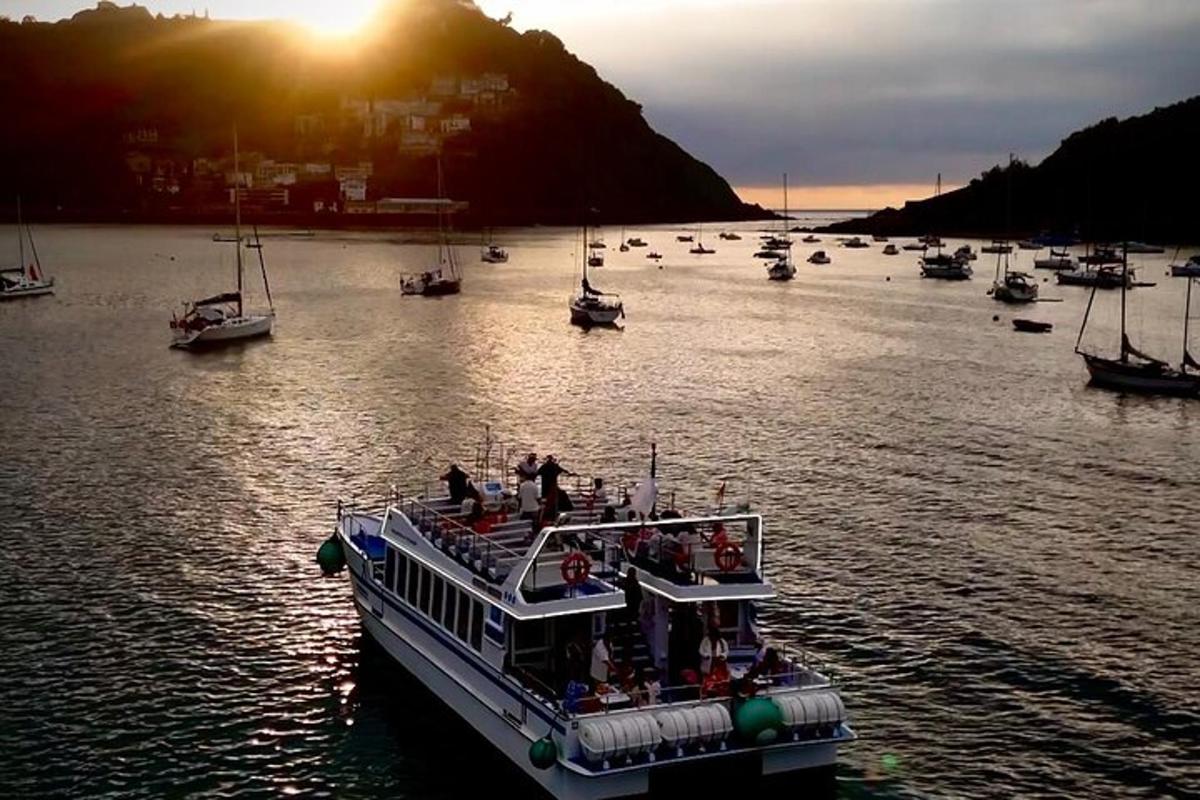 a boat with people on it in the water