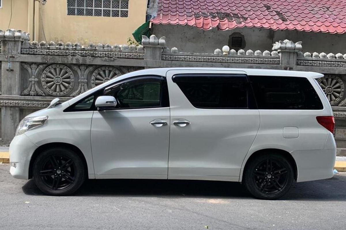 a white van parked in front of a building