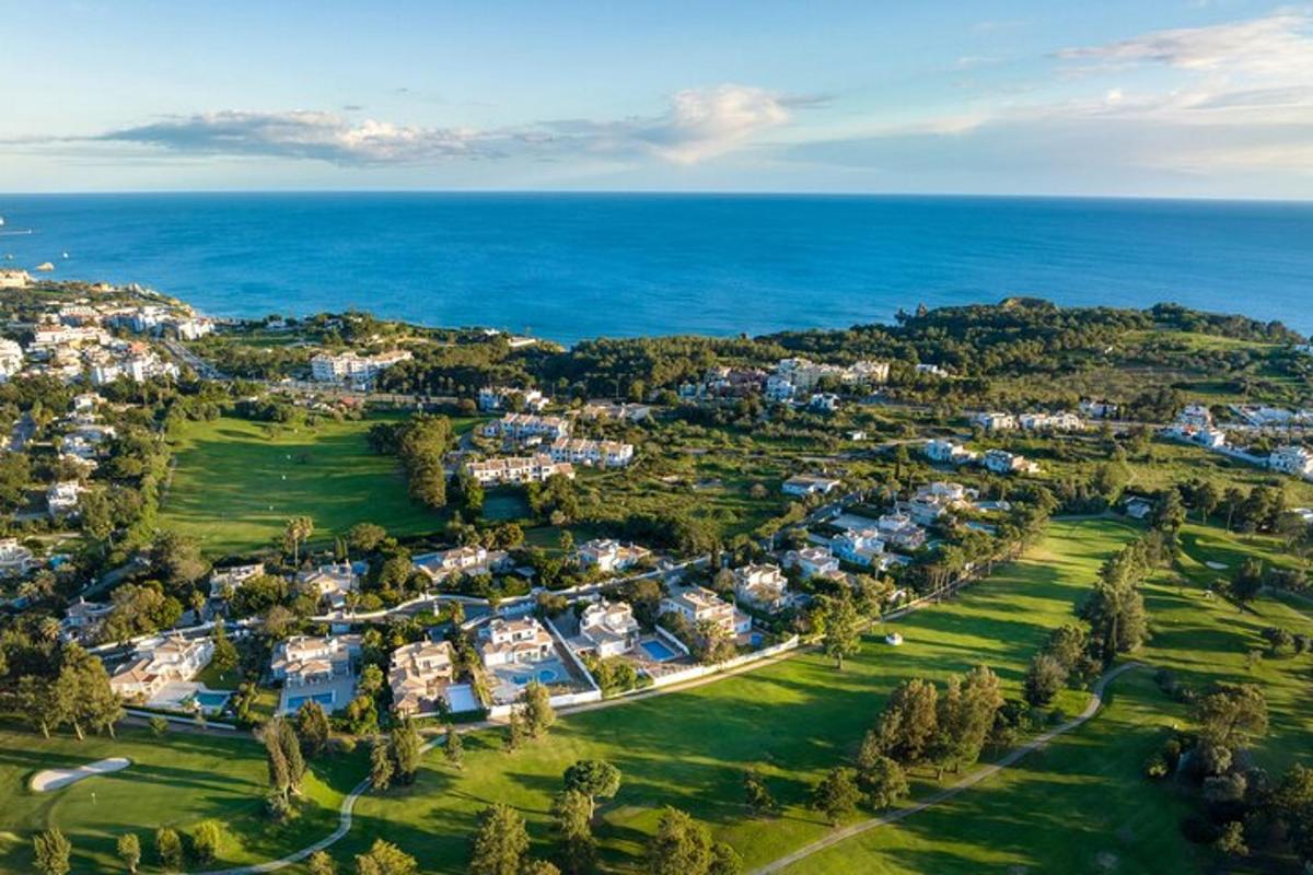 an aerial view of a resort near the ocean