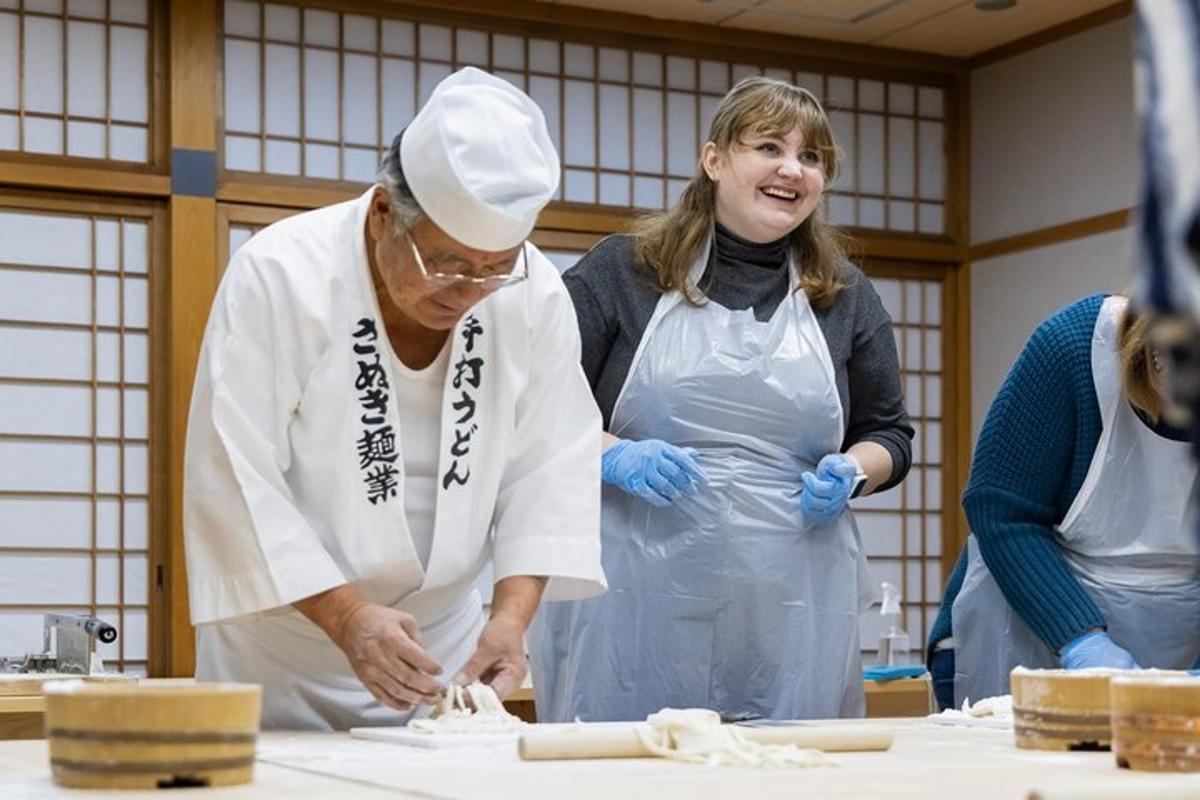 a man and a woman in a kitchen preparing food