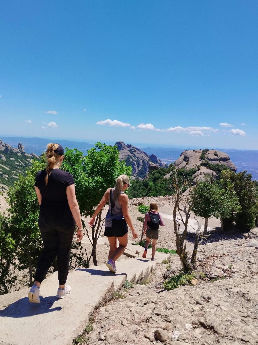 a group of people walking up a mountain