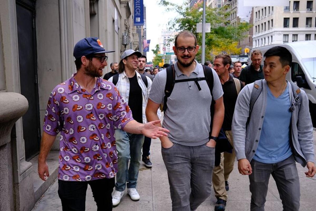 a group of men walking down a street