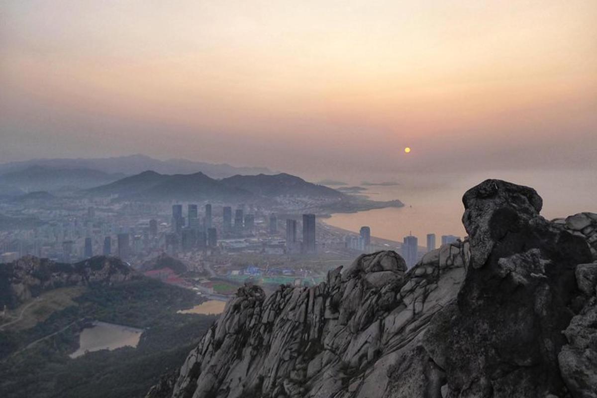 a view of a city from the top of a mountain