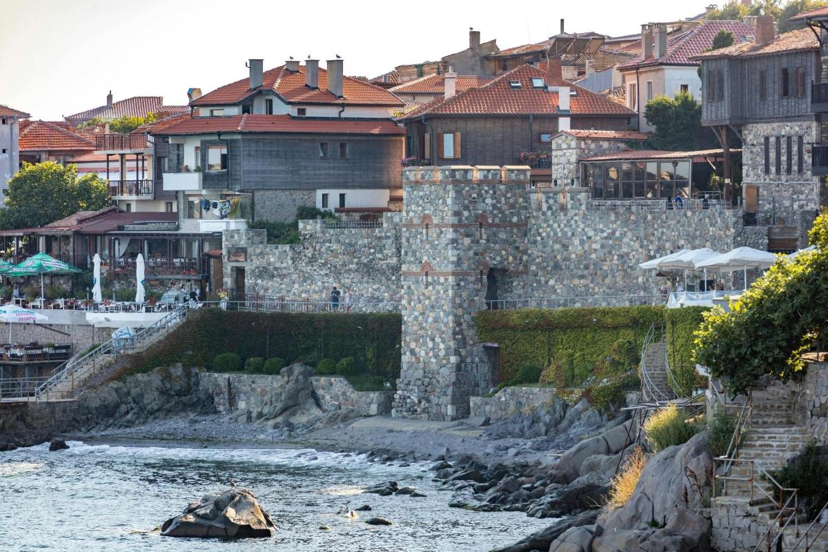 a view of a river with buildings in the background
