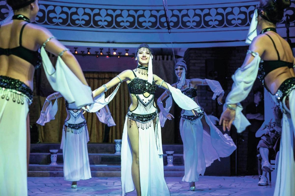 a group of performers on the stage at a performance