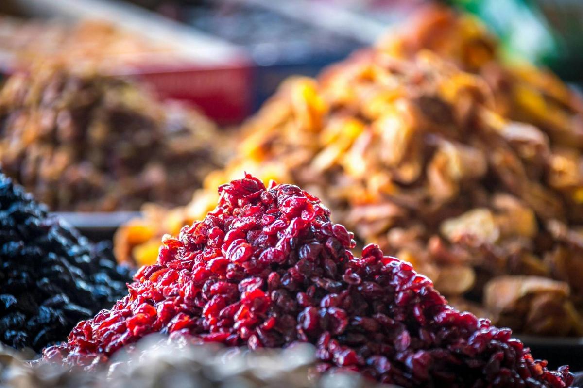 a pile oforted food on display in a market